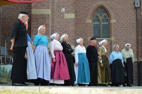 old people in traditional costumes of holland