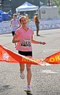 female runner at finish line