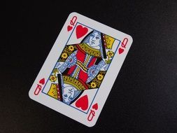 women's card on a dark surface