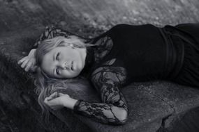 sexy woman with long blond hair in black and white image