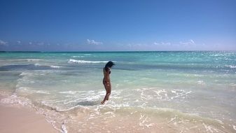 Woman on ocean coastline