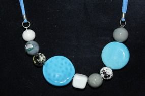 blue gray lady strings of beads