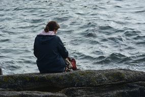 Alone woman on sea shore