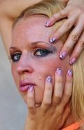 portrait of a blonde in bright makeup