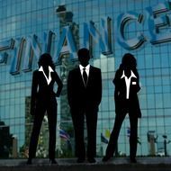 silhouette of a team of businessmen on the background of the inscription finance