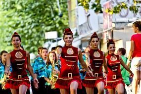 girls on parade in red suits