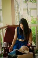 student girl sitting on the armchair