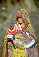 indian woman with child in hands