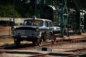 retro car on railway tracks