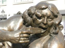 Bronze statue of eating women