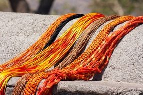 orange textiles on stone