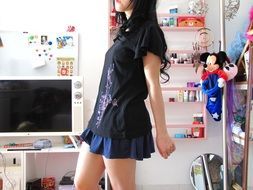 girl in a short skirt and a black T-shirt