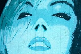 blue graffiti of a female face