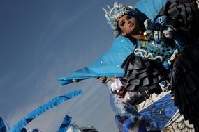 woman in bright costume dancing