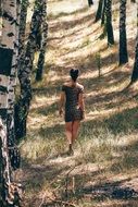 woman walking in a forest