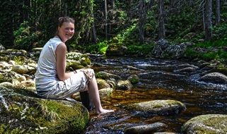 girl at the forest river