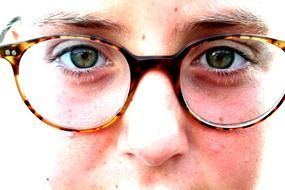girl staring through glasses