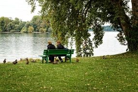 couple on a bench by the lake