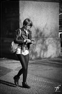 Modern girl walking in the street