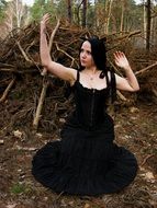 young lady in the Gothic style on a background of nature