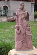 statue of a woman with children