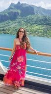 Beautiful Woman in bright dress french polynesia resort