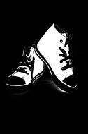 drawn white shoes on black background