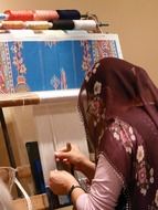 woman at work handmade carpets