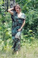 photo of the girl in a green dress on nature