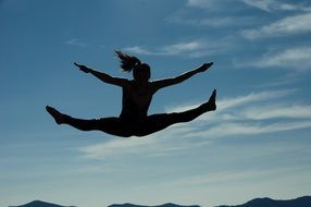 girl in a wide jump