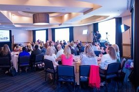 People in hall, business conference