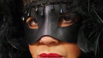 girl in black mask in Venice, Italy