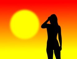 black silhouette of a girl on a background of colorful sunset