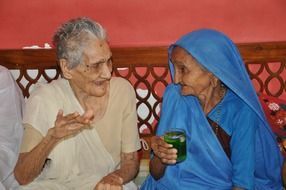 two old asian women talking, india
