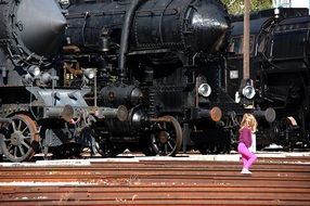 girl watching retro locomotives