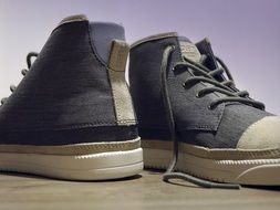 a pair of grey sneakers