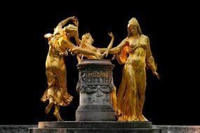 golden sculptures of mozart fountain, germany, drezden