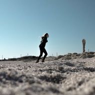 girl runs across the field