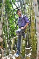 Posing young man in a forest