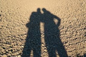 couple shadow on the sand