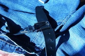 black leather belts and jeans