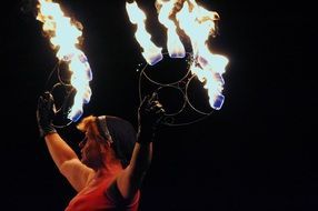 woman performs with fire