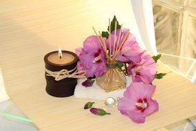fragrant candle and flowers