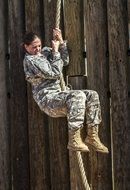 photo of a girl soldier on a tightrope