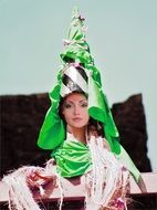 woman in the green headwear