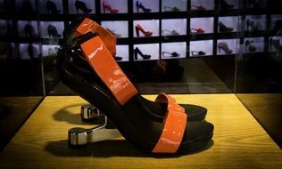 sandals in a glass box