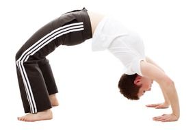 short-haired girl doing bridge exercise