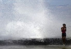 A girl near the high wave