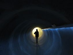 Girl stands in the tunnel