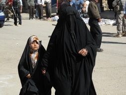 Mother with child in the Iraq